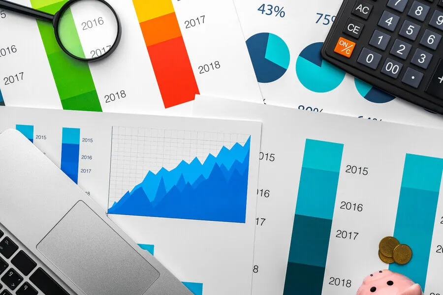 business-graphs-paper-and-calculator-on-table-2021-09-04-08-54-02-utc.8DBewn7.webp