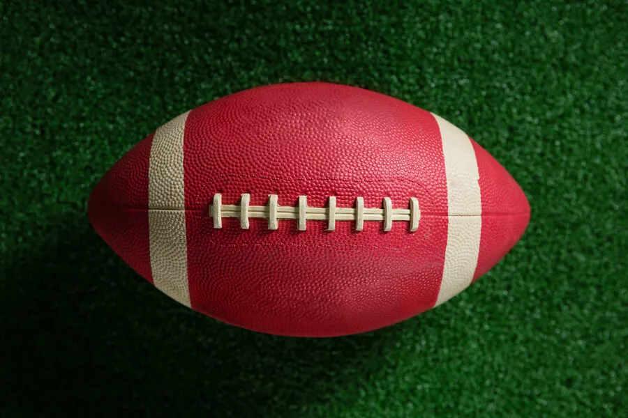 close-up-of-american-football-on-artificial-turf-2021-08-28-17-21-57-utc.bfFyIMk.webp