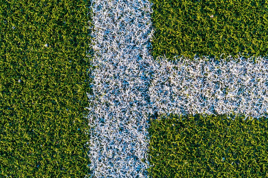 white-lines-on-a-green-artificial-football-field-2021-08-26-18-12-21-utc.AiKuO2d.webp